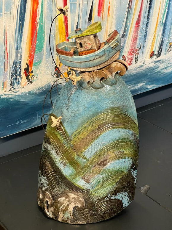 Ceramic boat on a wave by Alison Jones